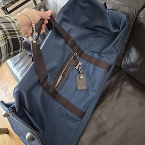 Tumi Blue and Black Men's Travel Duffle Bag With Wheels
